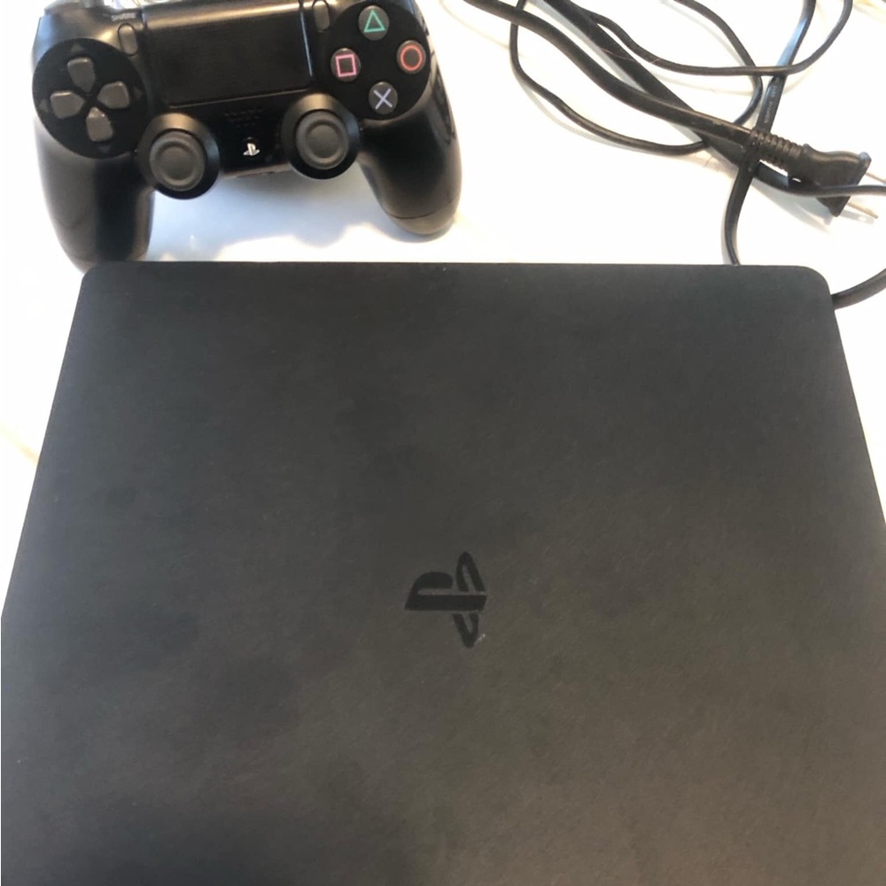 A  1 month old ps4 comes with a controller and all the cords . available now!!